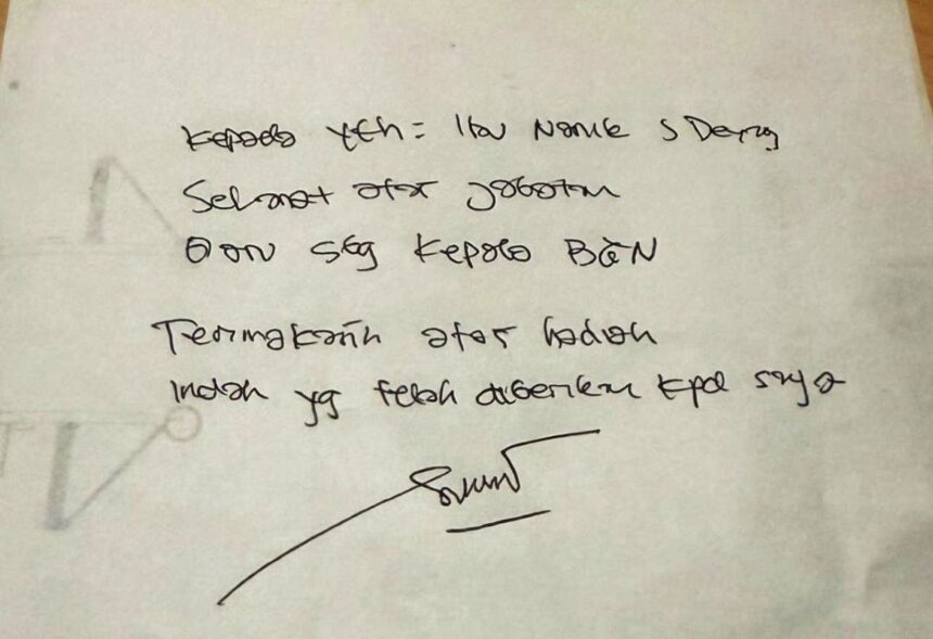 Handwritten note on white paper with a signature at the bottom; faint circular doodle on the left edge.